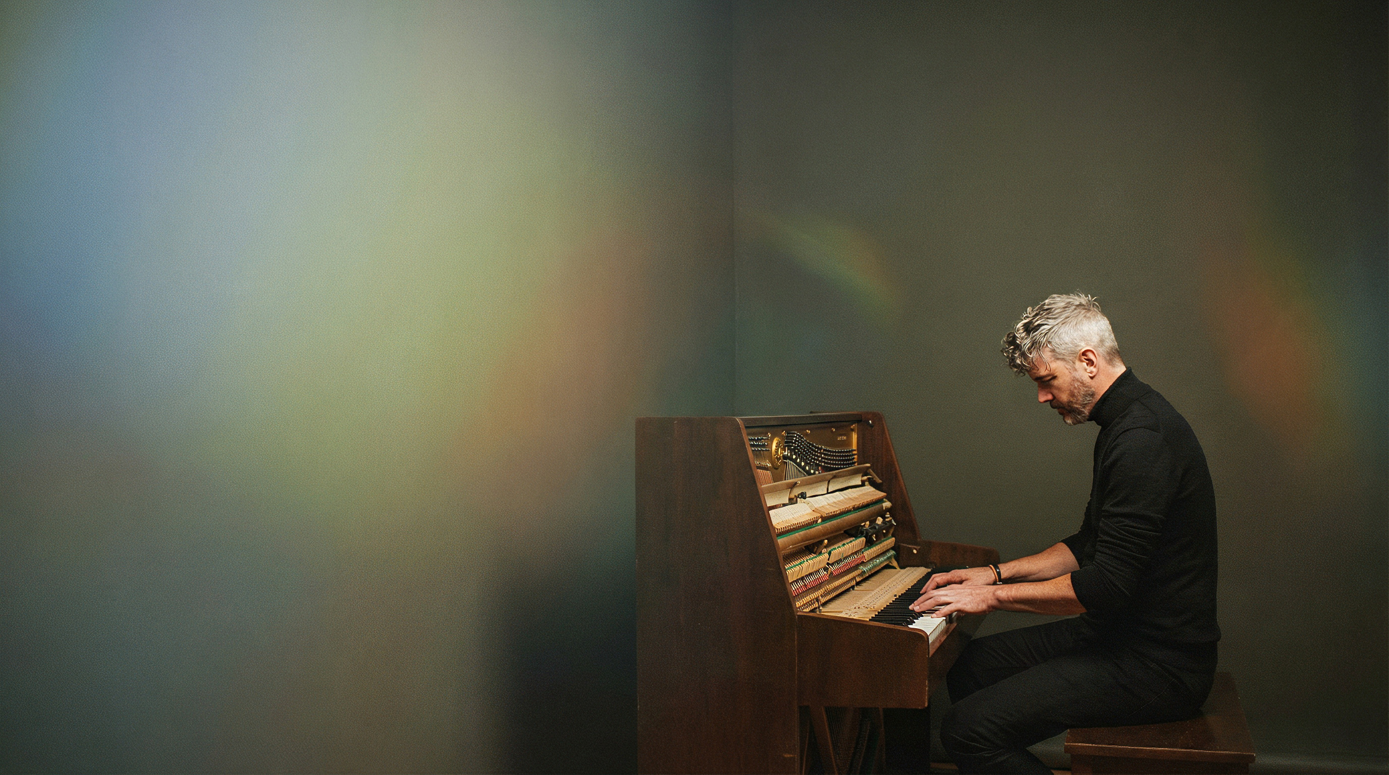 Frank DeLange playing piano